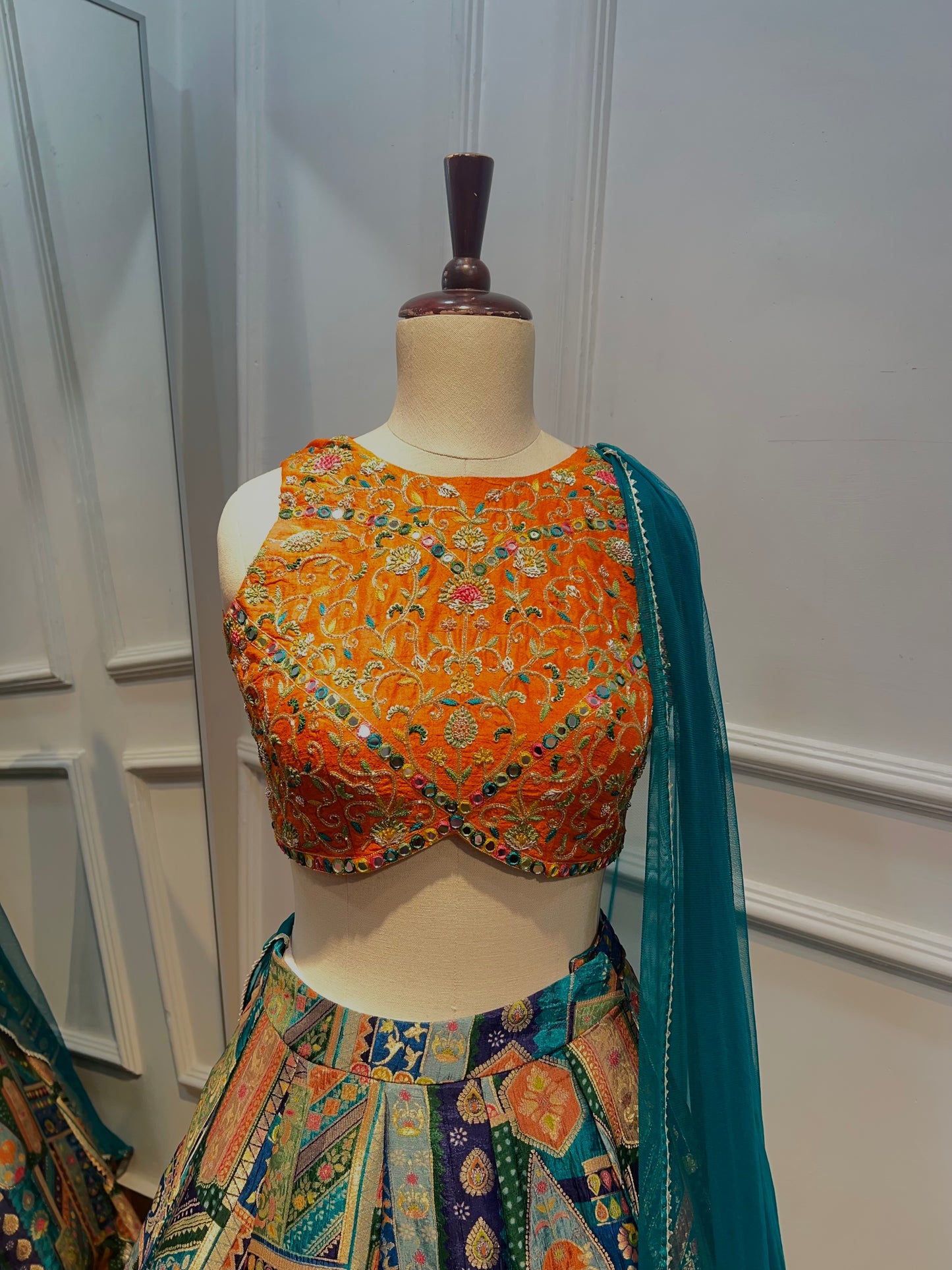 Banarasi Lehenga with Hand-Embroidered Raw Silk Blouse.