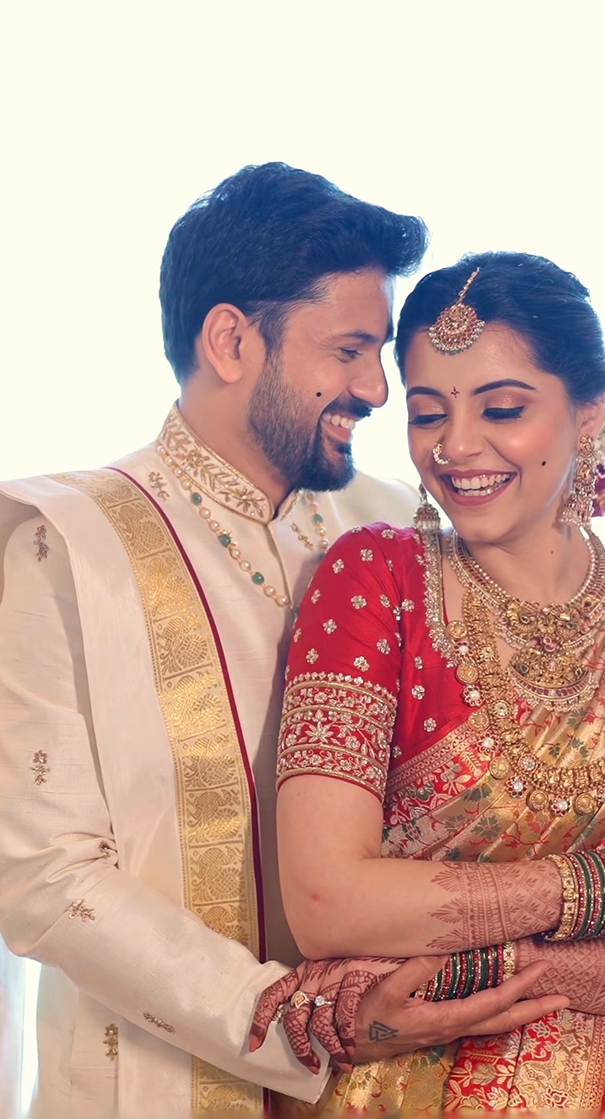 Beige & gold sherwani with dhothi-kanduva set for the groom