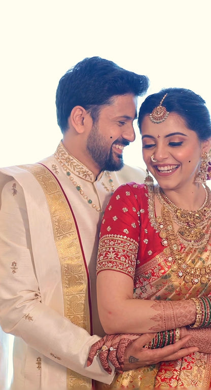Beige & gold sherwani with dhothi-kanduva set for the groom