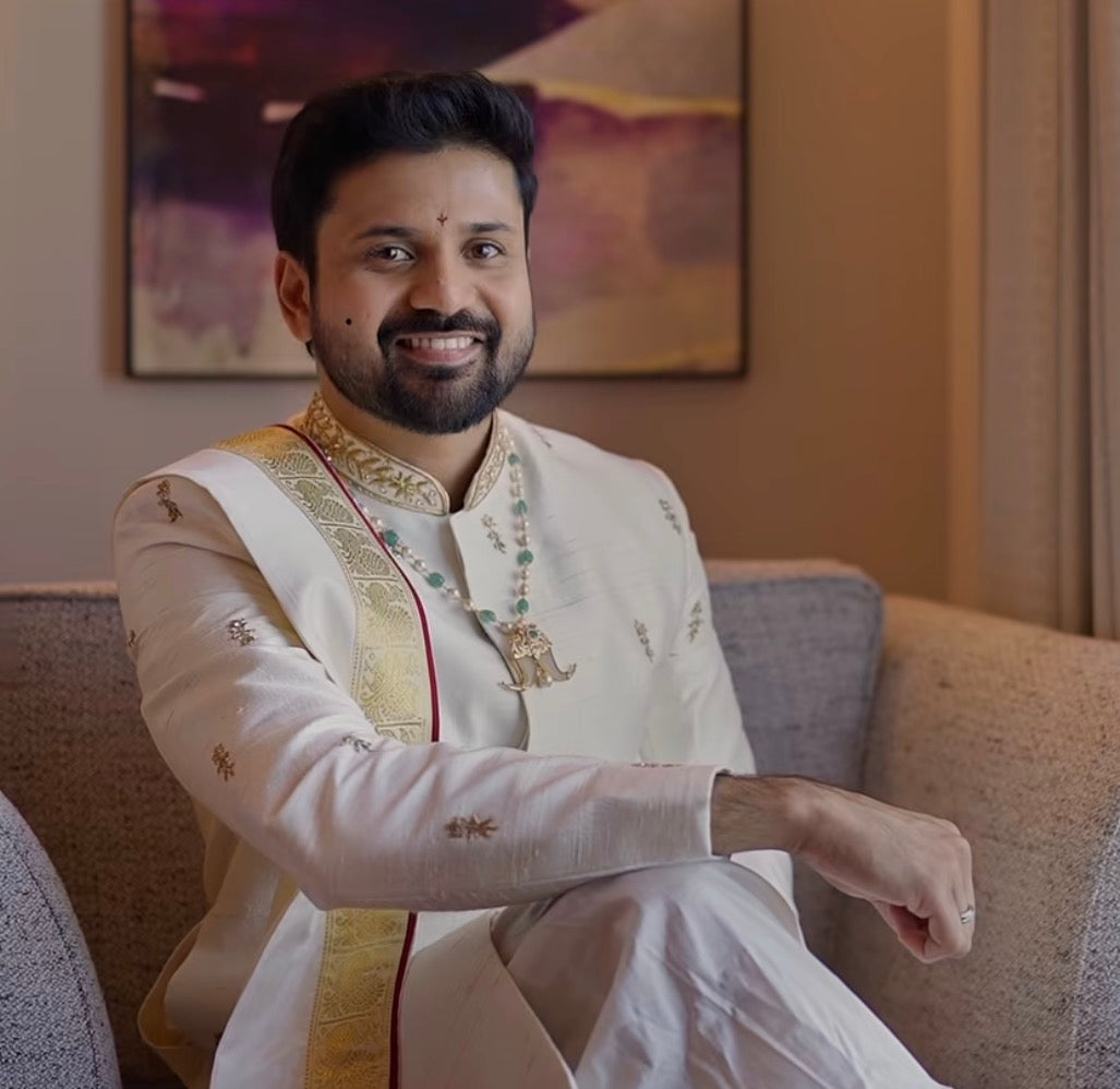 Beige & gold sherwani with dhothi-kanduva set for the groom