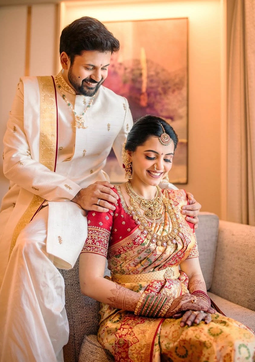 Beige & gold sherwani with dhothi-kanduva set for the groom