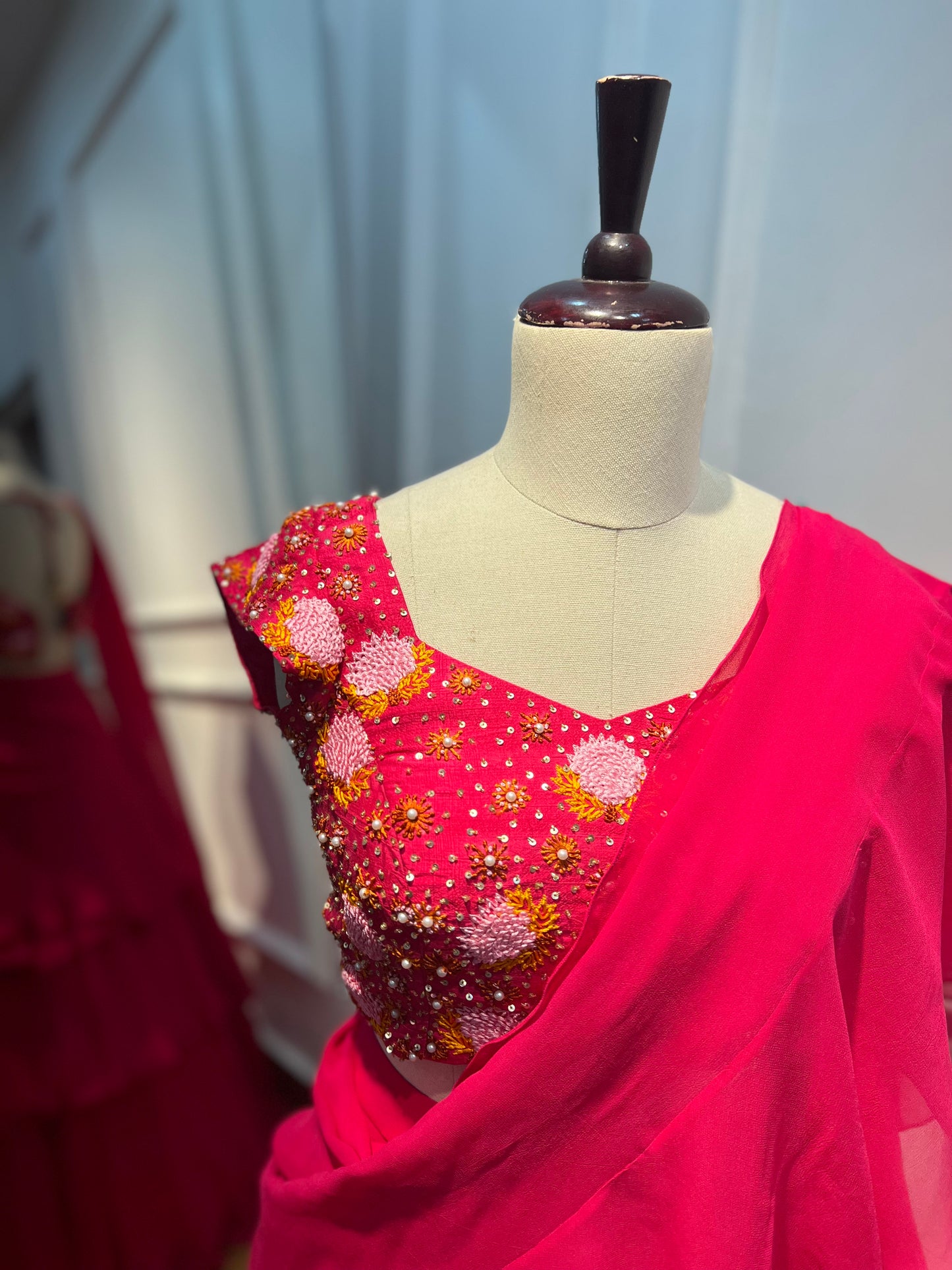 Fuchsia Georgette Ruffle Skirt Set with Hand-Embroidered Blouse