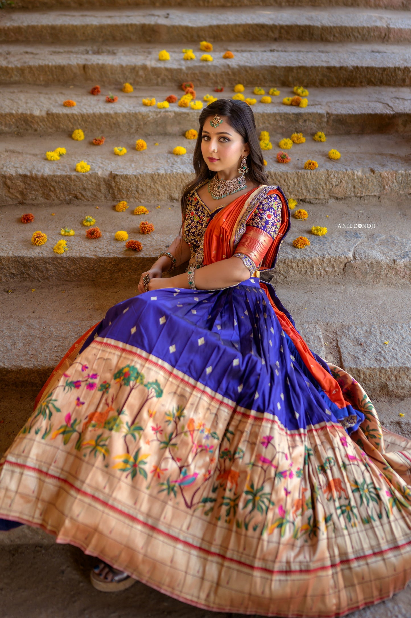 Blue Paithani Lehenga with hand embroidered blouse and Orange Pattu Dupatta