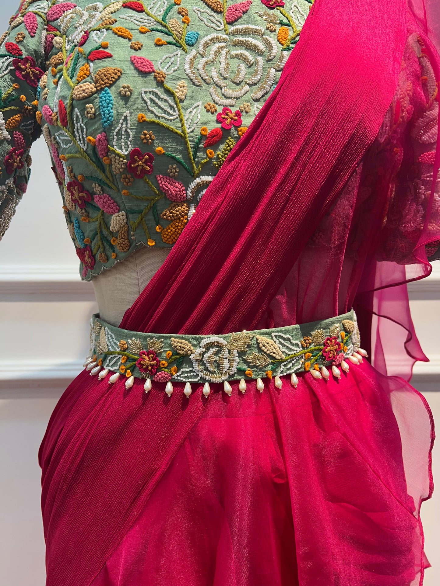Pink pre draped ruffle saree with hand embroidery blouse