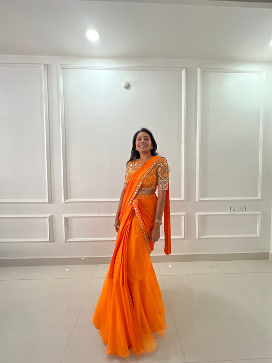 Orange pre draped ruffle saree with hand embroidery blouse