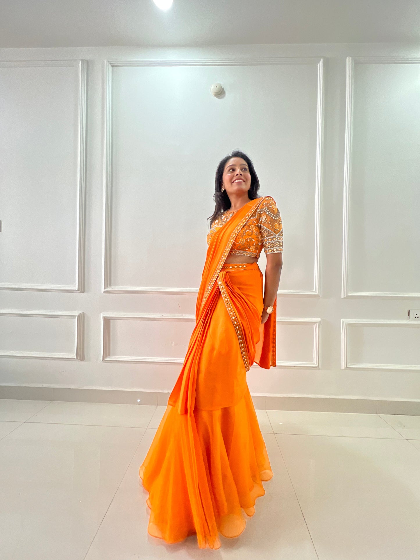 Orange pre draped ruffle saree with hand embroidery blouse
